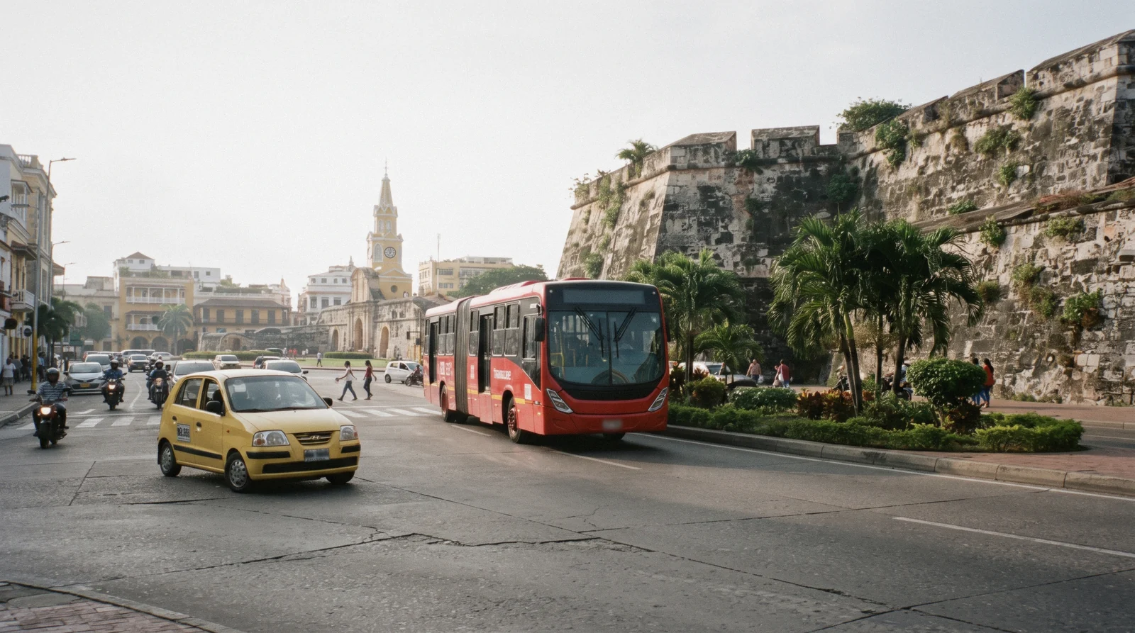 A Transcaribe articulated bus at a dedicated station platform in Cartagena