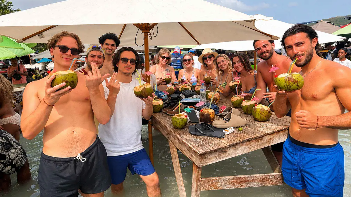 A speedboat full of travelers dancing near Cholon on a Rosario Islands party tour from Cartagena, Colombia