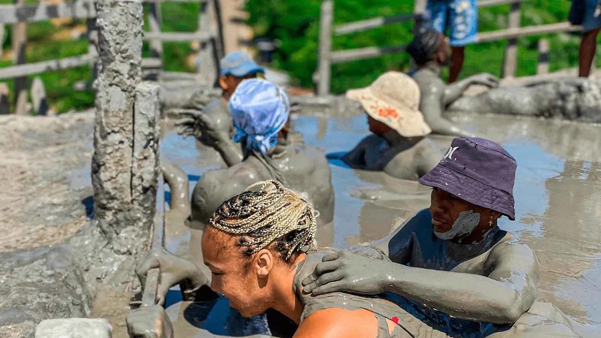 A traveler covered in therapeutic mud inside the Volcan del Totumo crater near Cartagena, Colombia